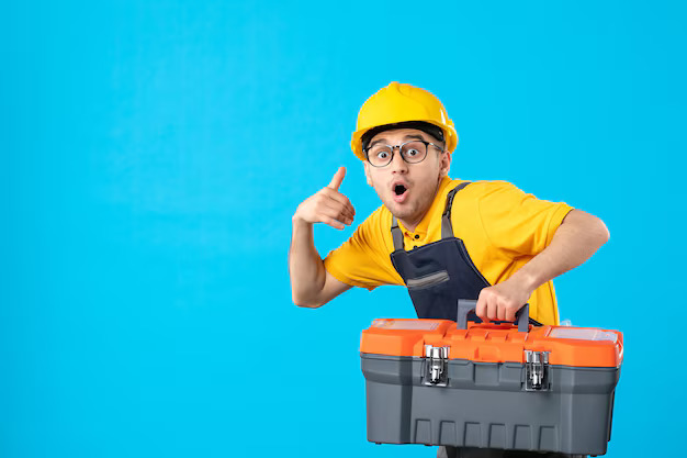 front view hurrying male worker yellow uniform with tool box blue surface